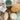 Bread and butter on a wooden board with a cup and a package of bread mix.